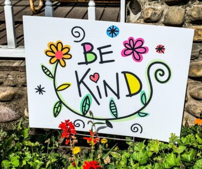 Kindness poster in a garden